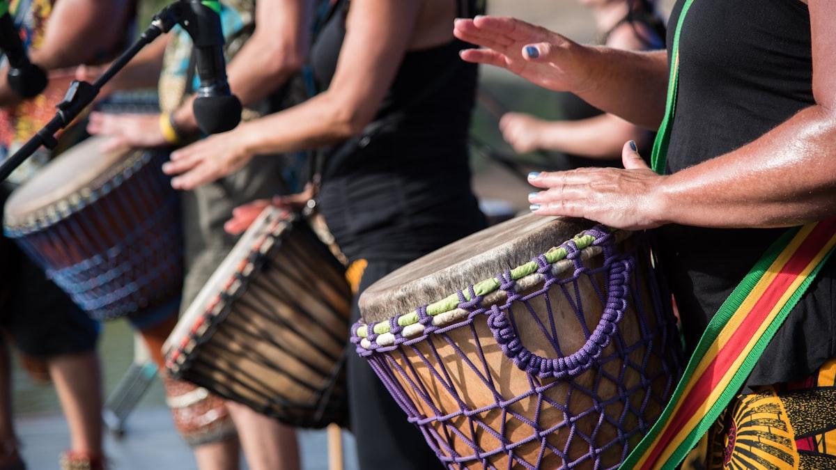 Hands on goblet drums during an evening performance
